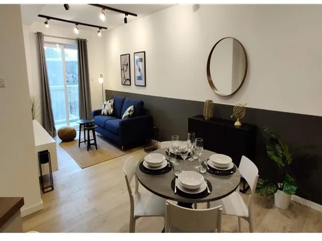 a dining room table with a white tablecloth