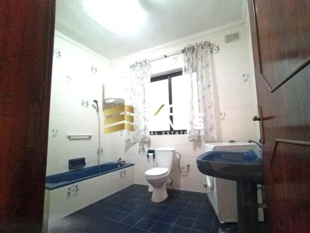 a bathroom with a toilet, sink, tub and shower