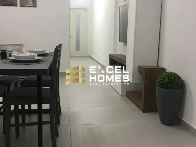 a kitchen with a table and chairs and a table cloth