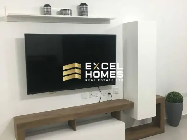 a wall mounted television on a wall