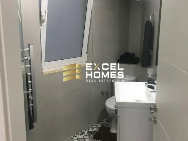 a bathroom with a toilet and a sink