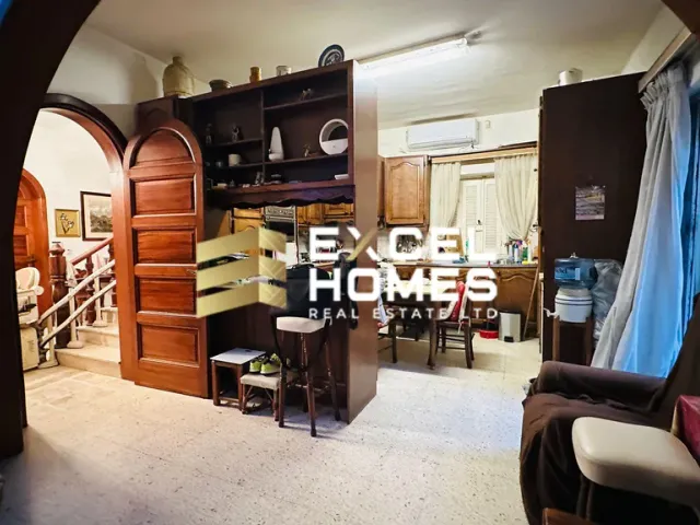 a living room filled with furniture and a tv