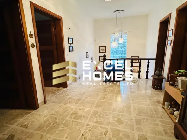 a room with a door and a staircase
