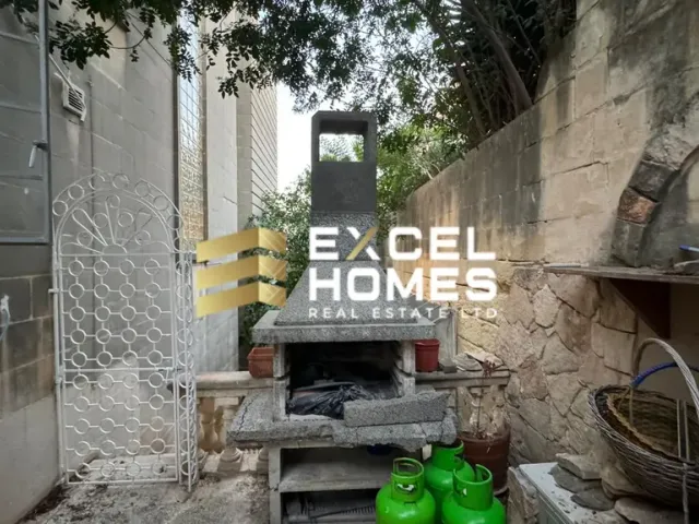 a bench in front of a building with graffiti on it