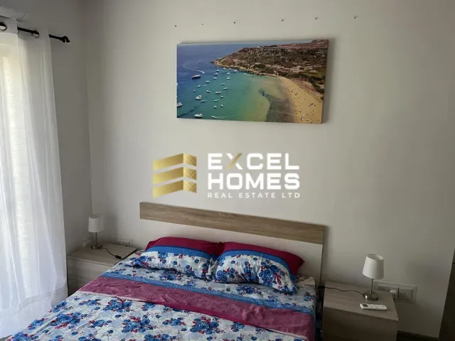 a bed with a picture of a woman on it