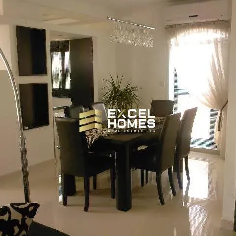 a table with a chair and a table cloth