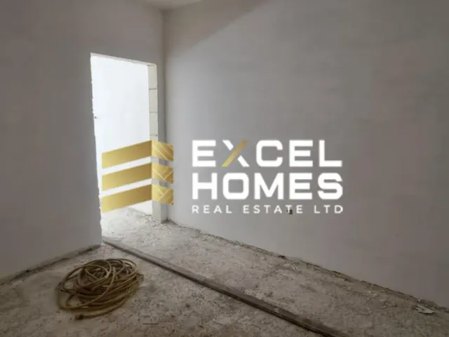 a wall with a broken down toilet and a broken down wall