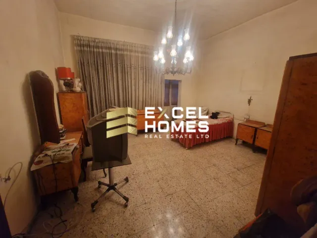 a room with a couch, chair, and a table