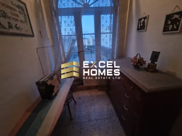 a room with a window and a bed