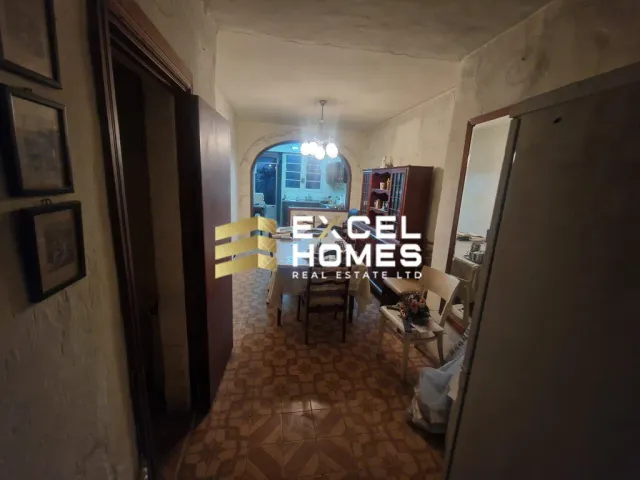 a room with a door open and a dog on the floor