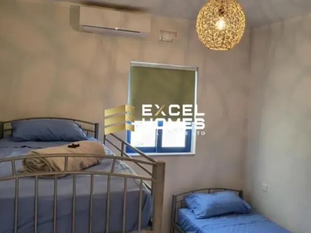 a bedroom with a bed and a desk