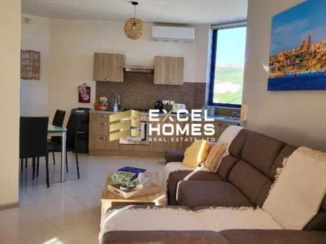 a living room with a couch, table, and chairs