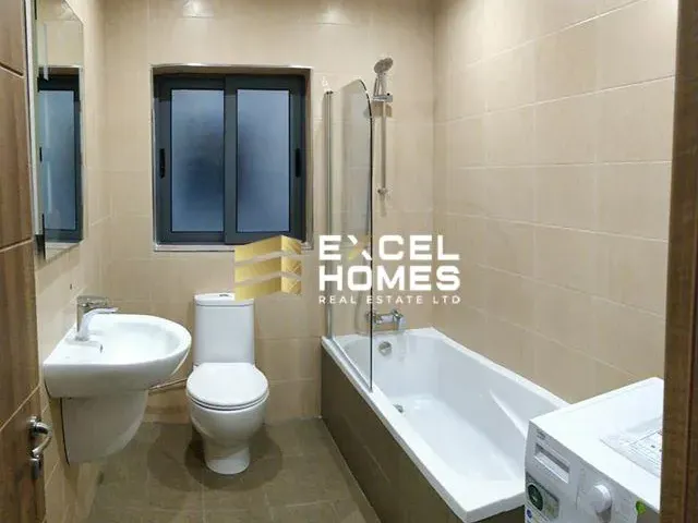 a bathroom with a toilet, sink, tub and shower