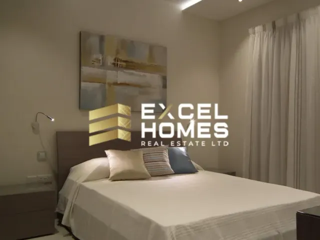 a bed with a white comforter and a white comforter