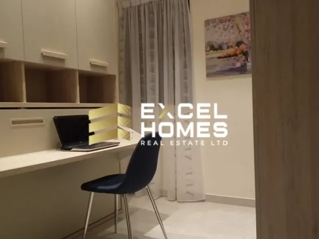 a room with a white chair and a white wall