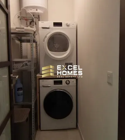 a white refrigerator with a black door