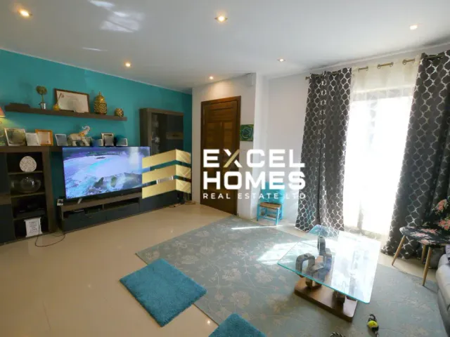 a living room with a tv and a couch