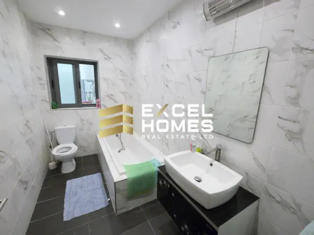 a bathroom with a sink, toilet and bathtub