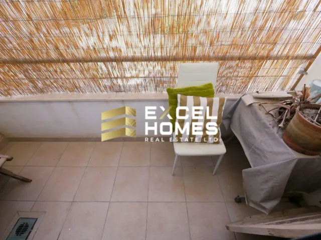 a room with a chair and a window