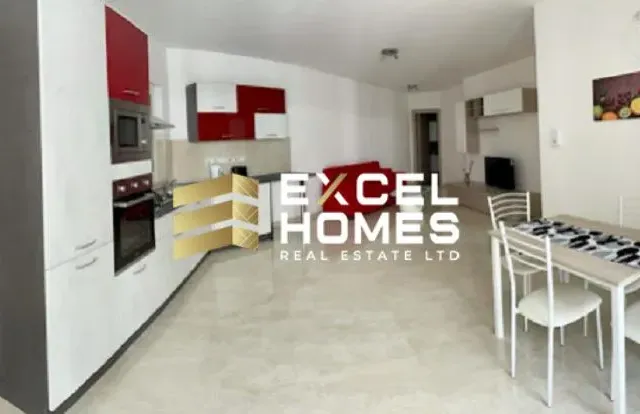 a kitchen with a stove, refrigerator, microwave and a table