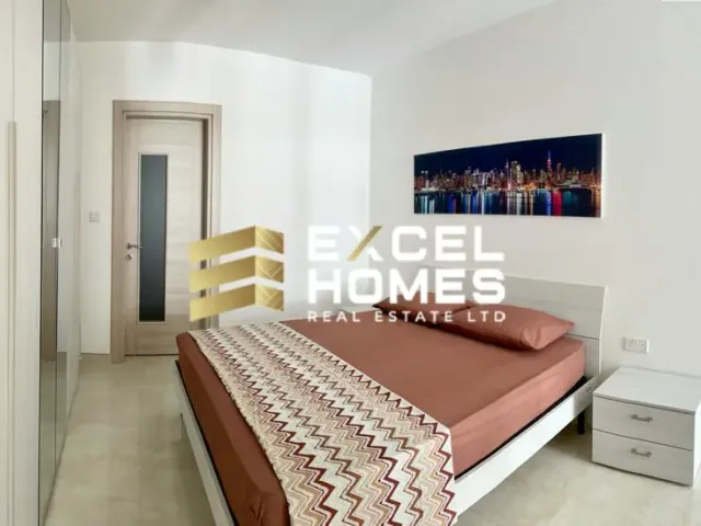 a bed room with a bed and a desk