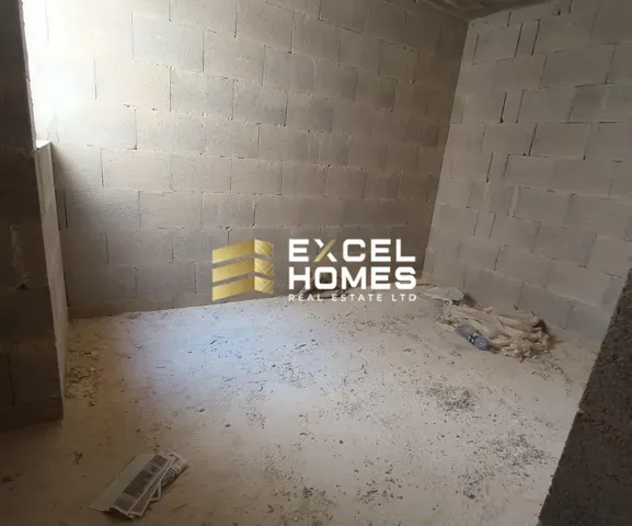 a wall with a broken toilet and a wall with graffiti