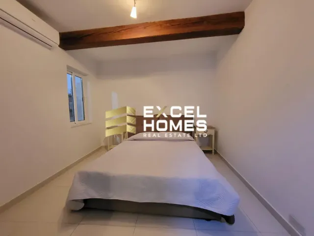 a bed room with a bed and a desk