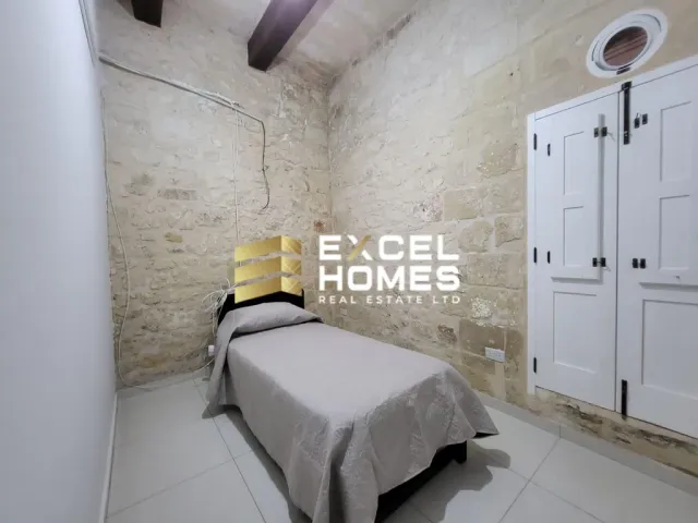 a bed with a white bedspread and a white bedspread