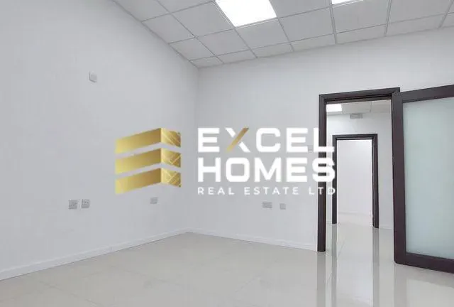 a bathroom with a mirror and a wall with a picture of a cat on it