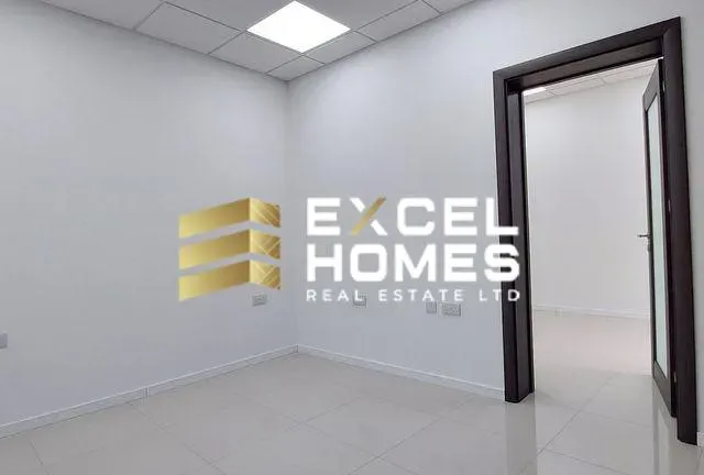 a room with a mirror and a wall with a blue wall