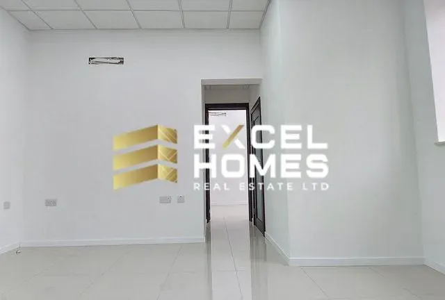 a hallway with a white wall and a blue wall