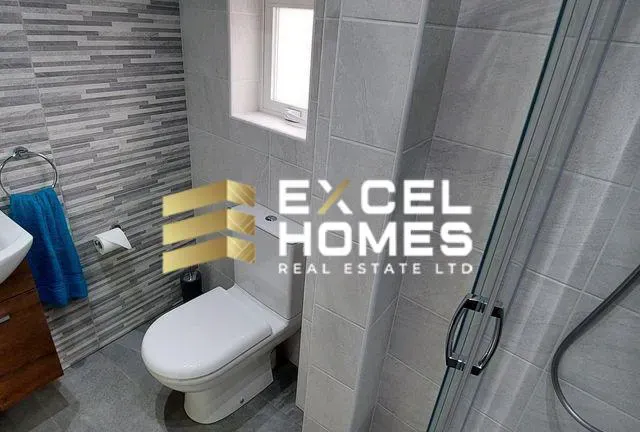 a bathroom with a toilet and a sink