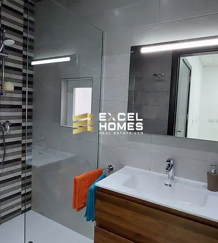 a bathroom with a mirror and a sink