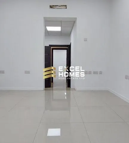 a room with a white floor and a black wall