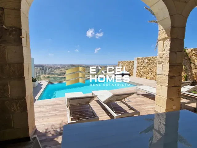 a pool with a balcony and a chair