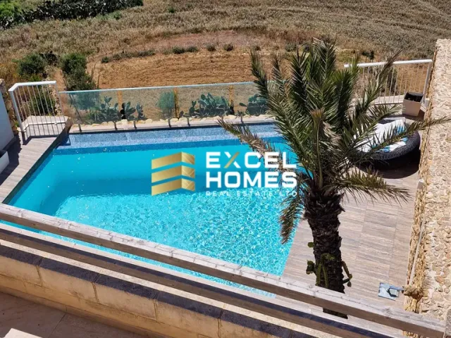 a pool with a pool table and a blue chair