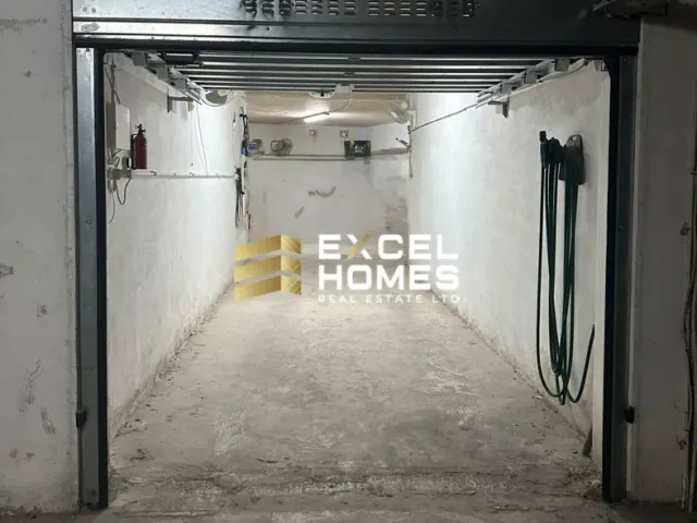 a door is open in a room with a wall