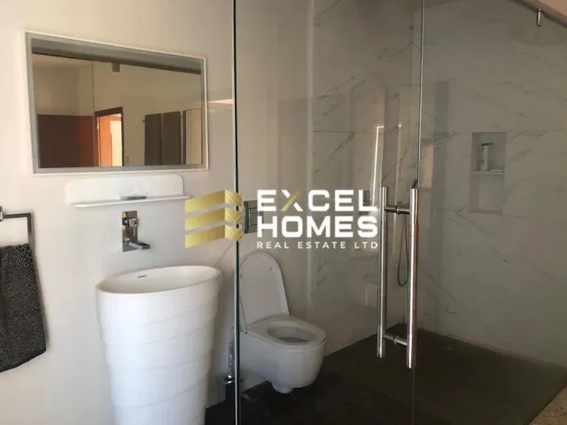 a bathroom with a toilet and a sink