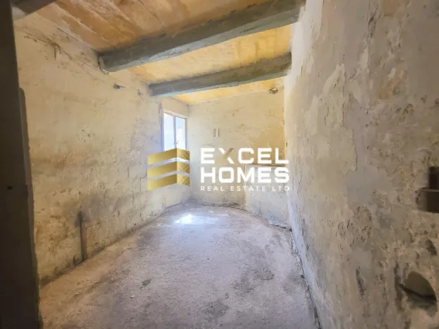 a wall with a door and a wall with a brick wall 