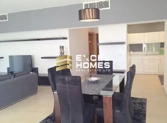 a dining room table with chairs and a table with a glass table