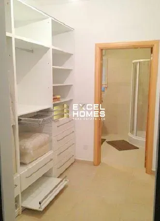 a bathroom with a white toilet and a sink