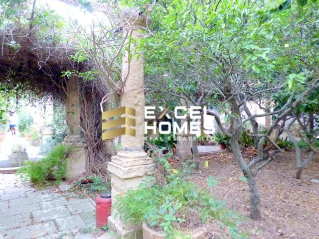 a fire hydrant is in the middle of a tree