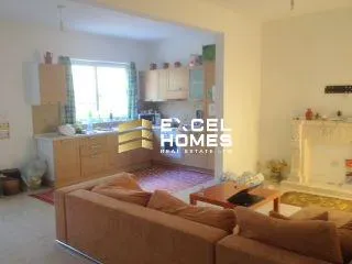 a living room with a couch, coffee table and a tv