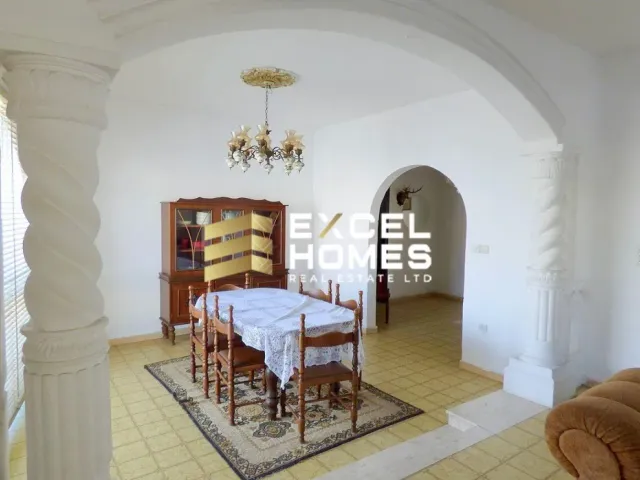 a room with a table and a chair in it