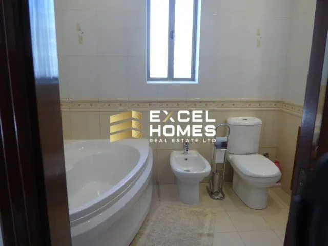 a bathroom with a toilet and a sink 
