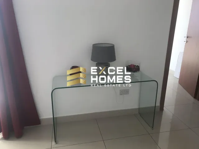 a television is on a shelf in a room