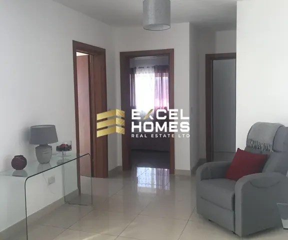 a living room with a couch, television and a coffee table