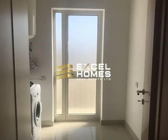 a bathroom with a white toilet and a black door