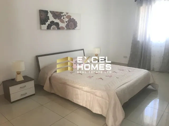 a bed with a white bedspread and a white bedspread