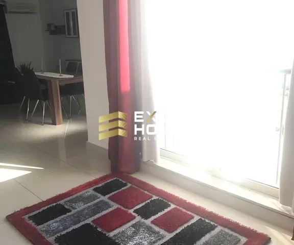 a red fire hydrant sitting next to a window